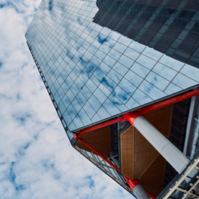 Clouds reflected in the glass facade of a skyscraper
